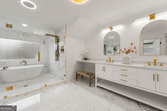 bathroom with vanity and vaulted ceiling