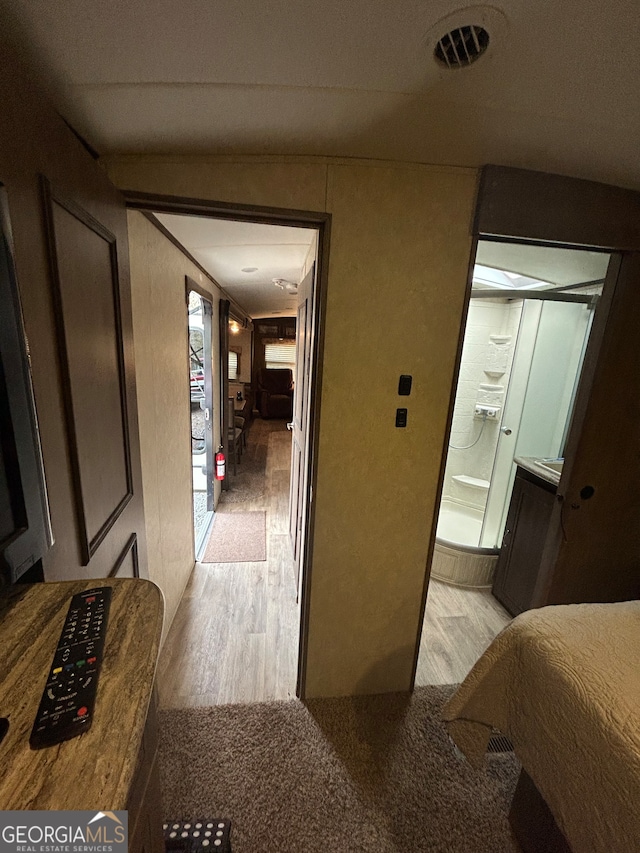 hallway with light wood-type flooring