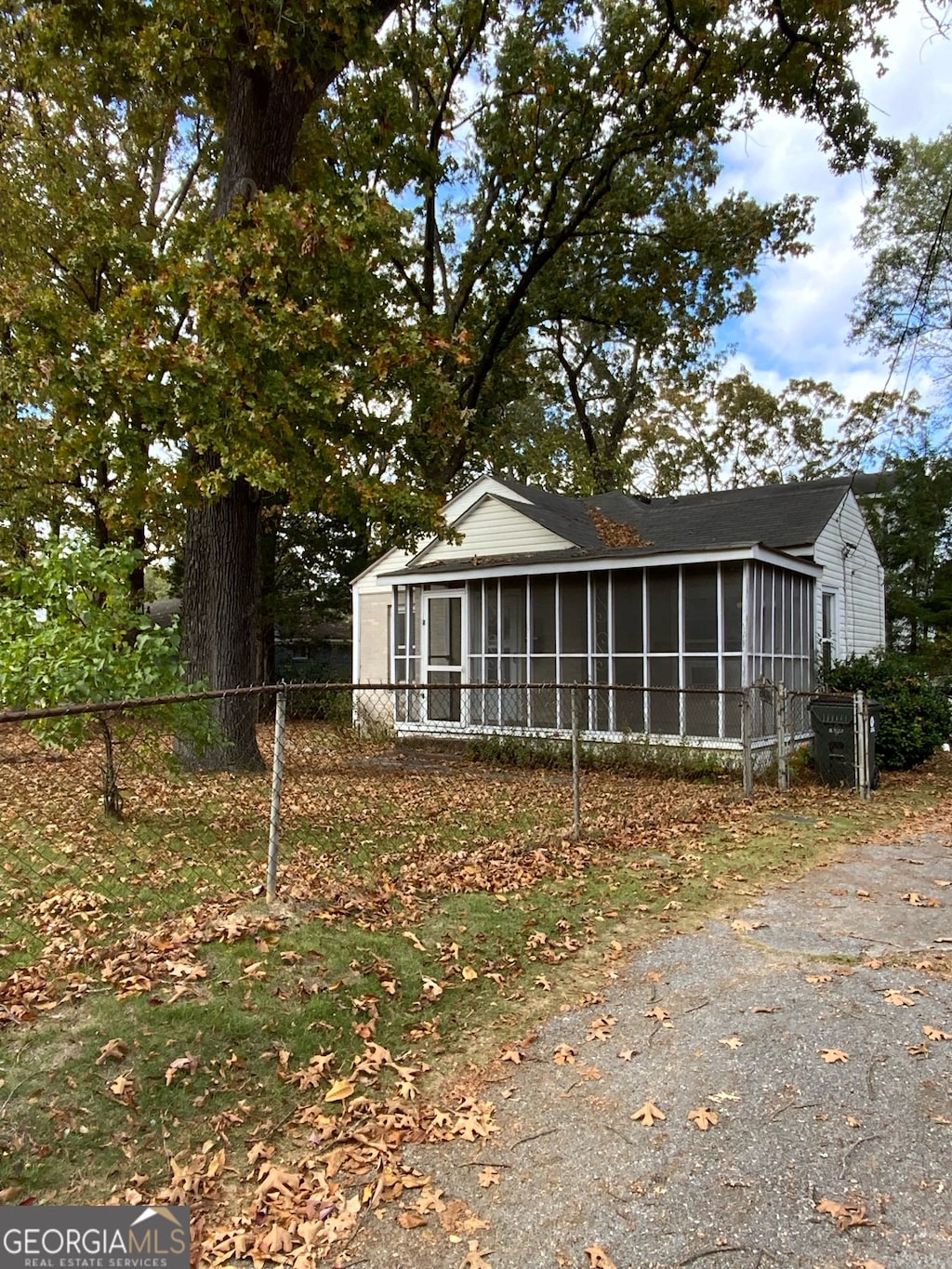 view of side of property with a sunroom