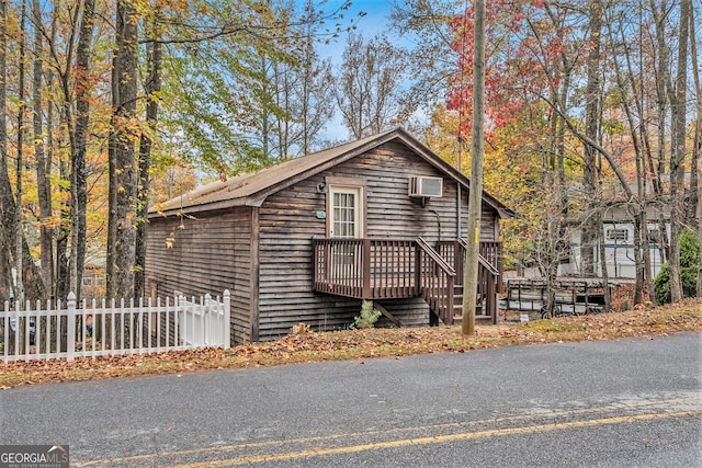 view of front of house featuring a wooden deck