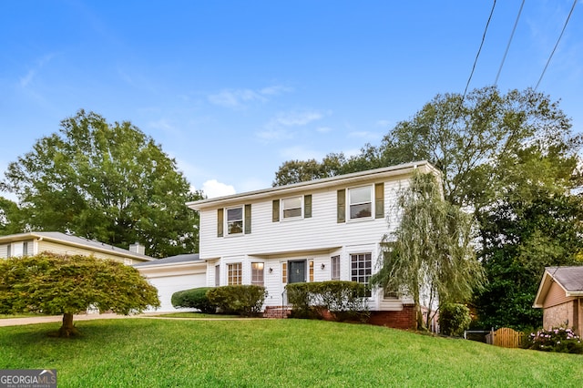 colonial-style house featuring a front yard