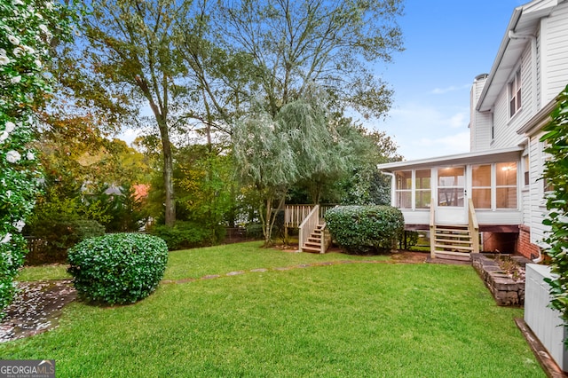 view of yard with a sunroom