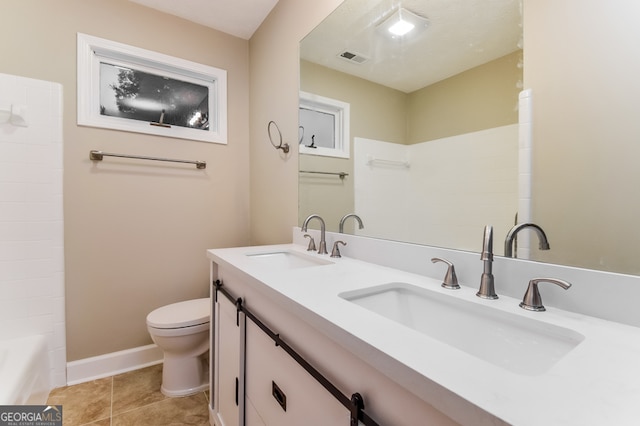 full bathroom featuring toilet, vanity, tile patterned floors, and bathtub / shower combination