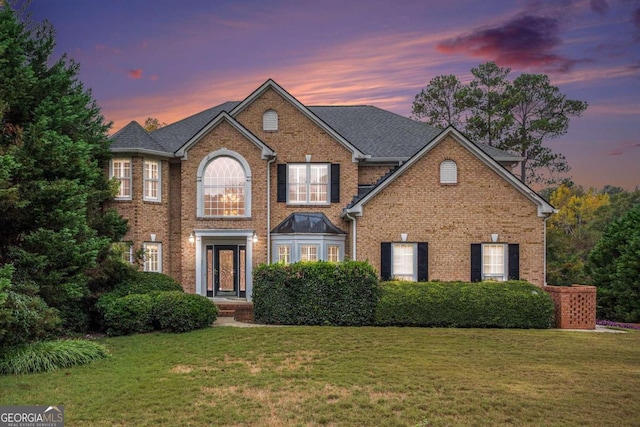 view of front of house with a yard