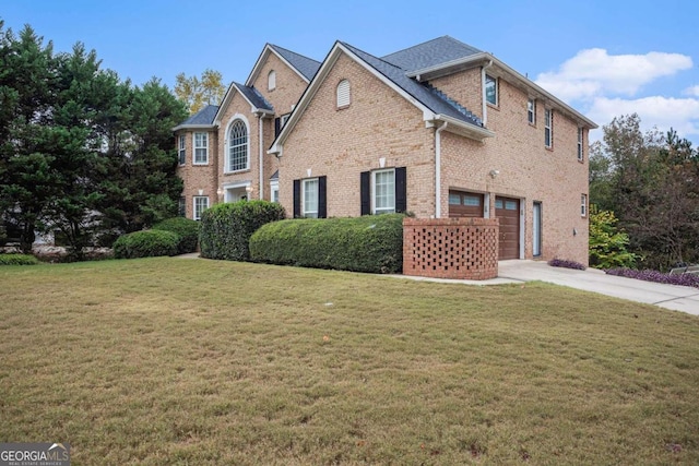 view of front of property featuring a garage and a front yard