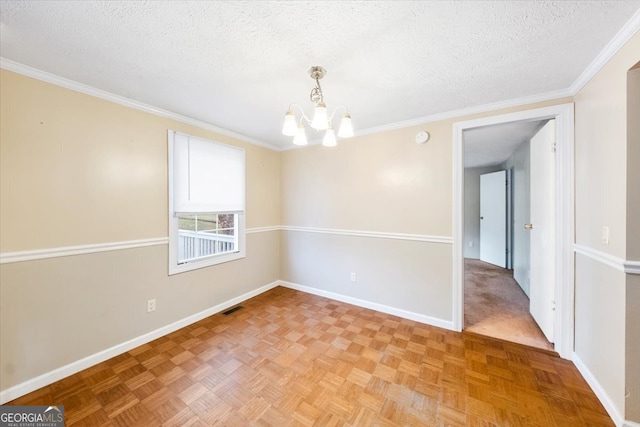 unfurnished room with parquet flooring, a textured ceiling, an inviting chandelier, and ornamental molding