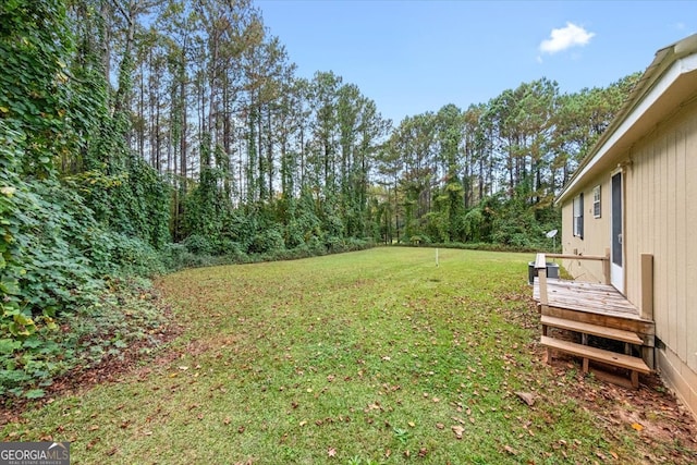 view of yard with a deck