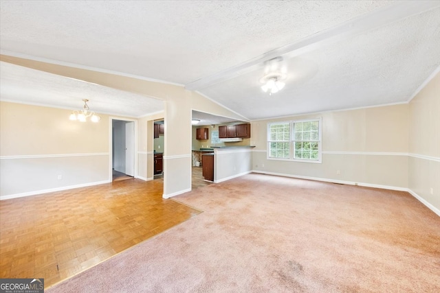 unfurnished living room featuring lofted ceiling with beams, light parquet floors, a chandelier, and a textured ceiling