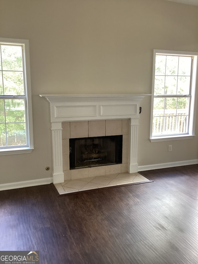 details with hardwood / wood-style flooring and a fireplace