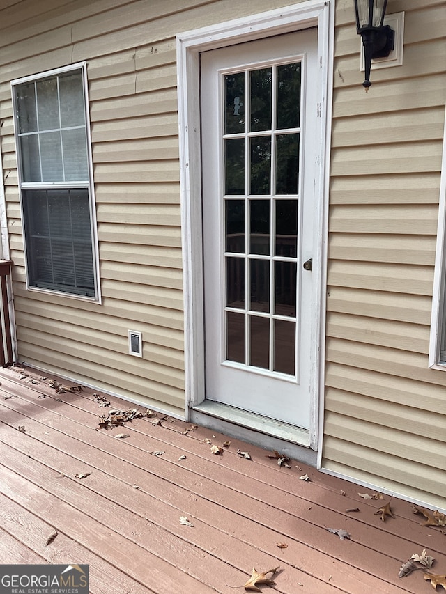 doorway to property with a wooden deck