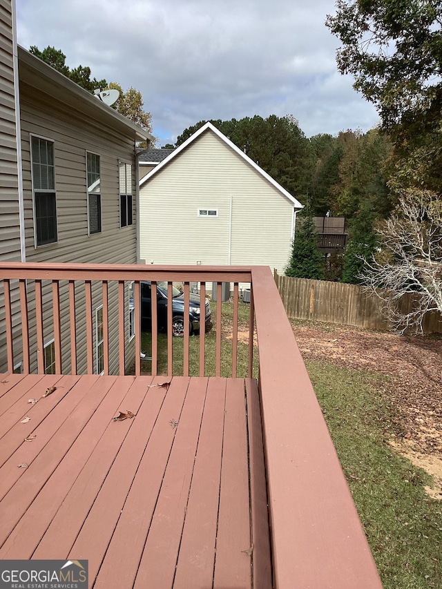 wooden deck with a yard