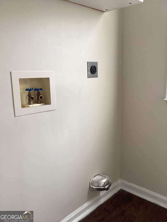 laundry room featuring washer hookup, hookup for an electric dryer, and dark hardwood / wood-style flooring