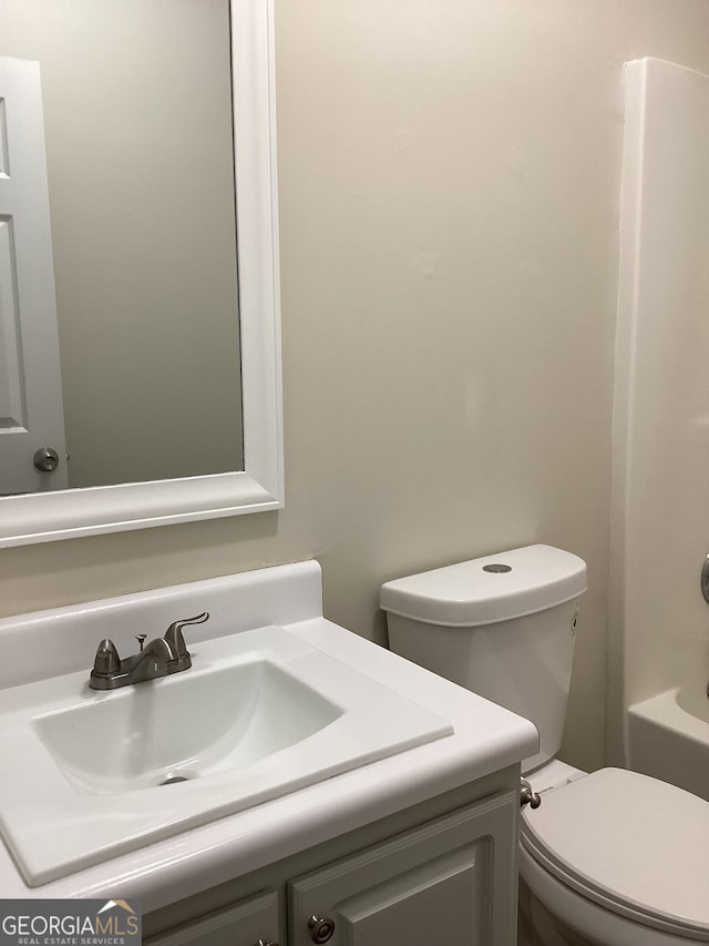 bathroom with toilet and vanity