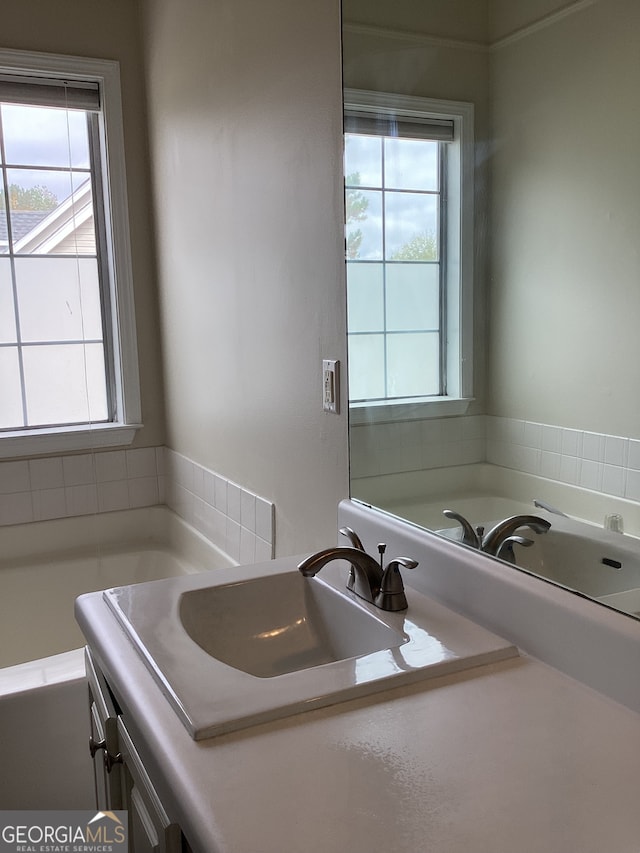 bathroom with a wealth of natural light and sink