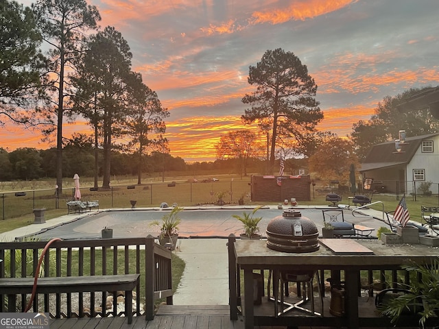 view of pool featuring fence, a fenced in pool, and a patio