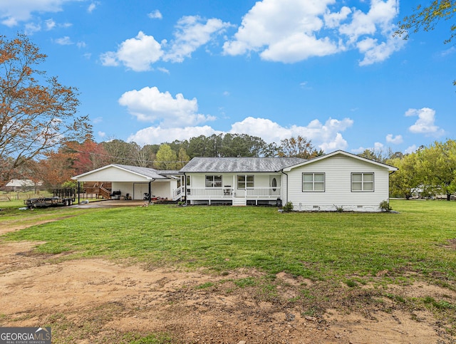 view of front of home featuring a carport, a front yard, crawl space, and dirt driveway