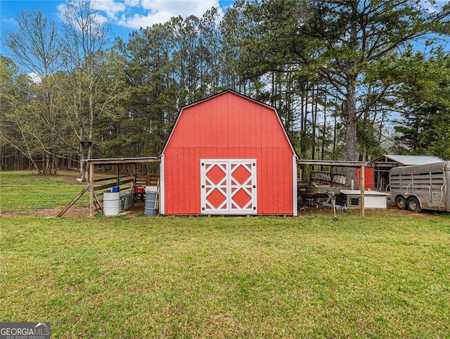 view of outdoor structure featuring a lawn