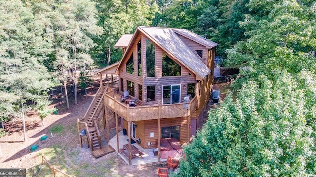 back of house with cooling unit and a patio