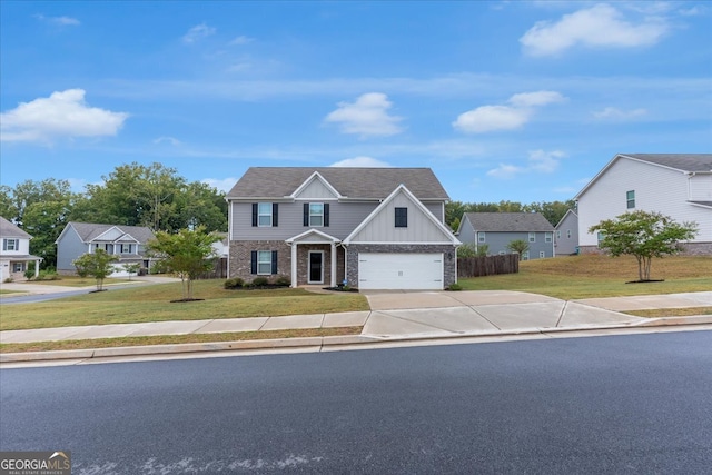 view of front of home featuring a garage and a front yard