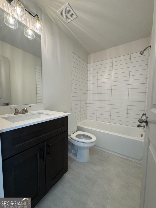 full bathroom featuring vanity, toilet, and tiled shower / bath combo