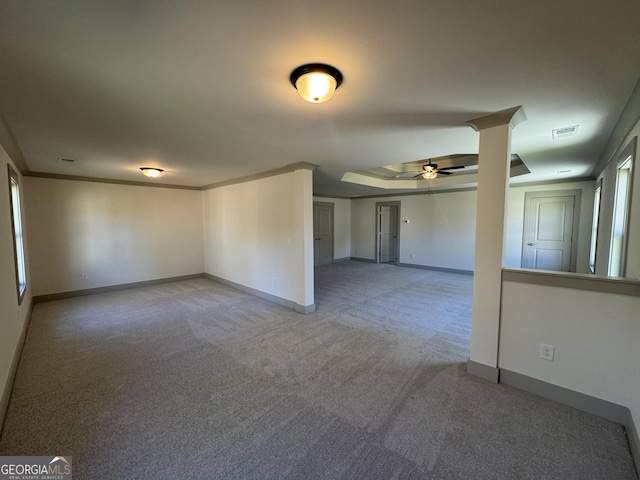 spare room featuring ceiling fan, light colored carpet, and ornamental molding