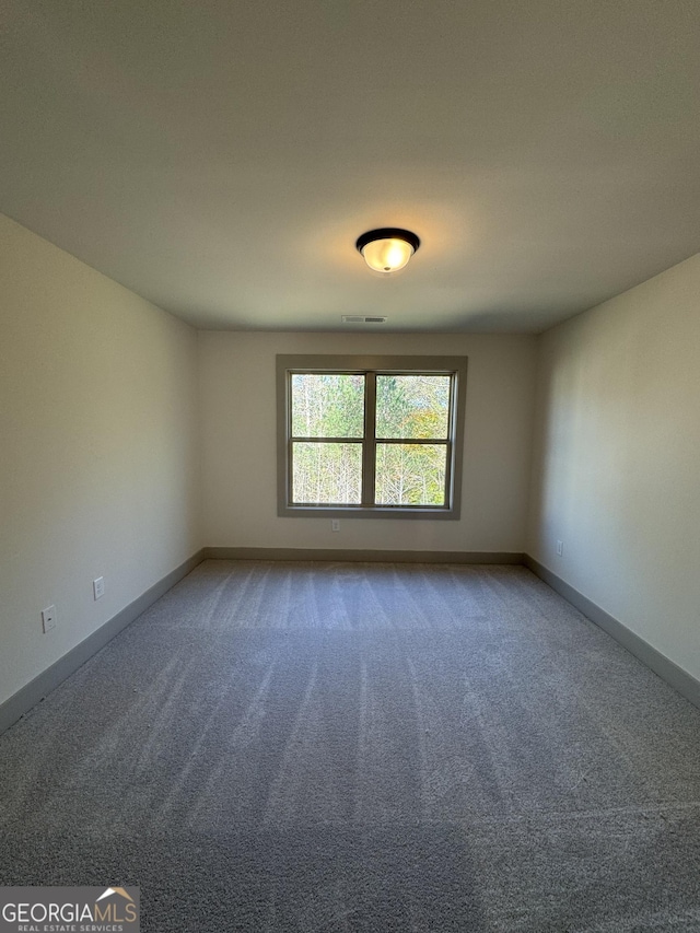 empty room featuring carpet flooring