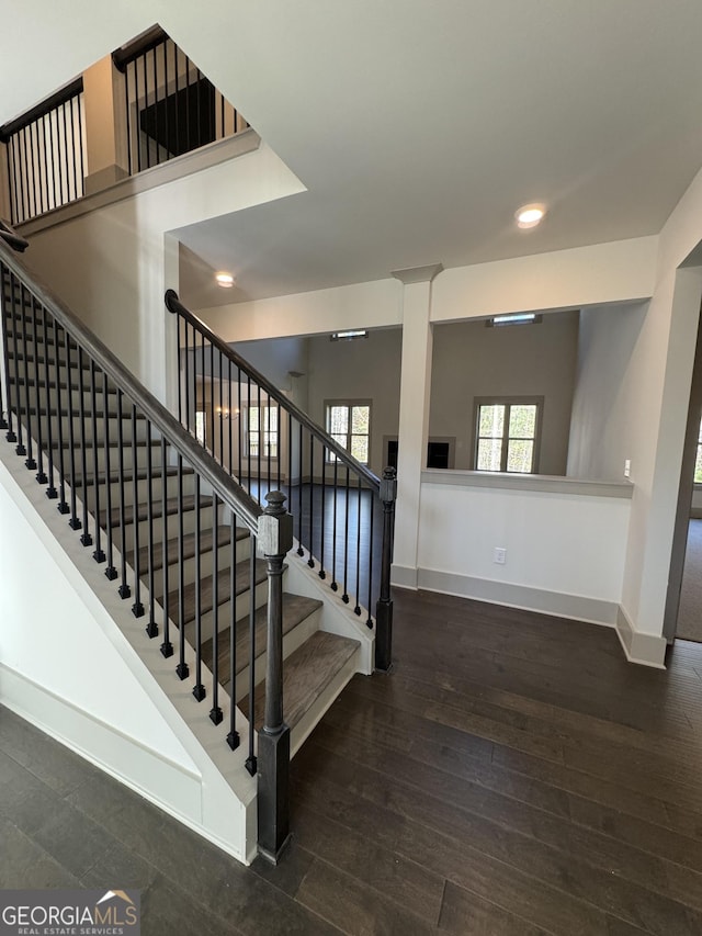 stairs with hardwood / wood-style floors