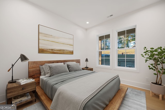 bedroom with wood-type flooring