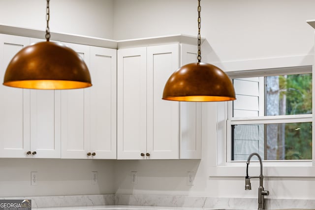 interior details featuring white cabinetry