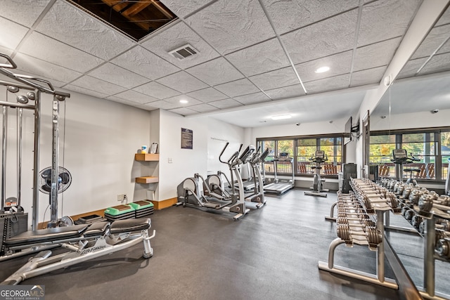 workout area featuring a paneled ceiling