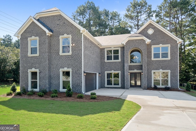 view of front of property featuring a garage and a front yard