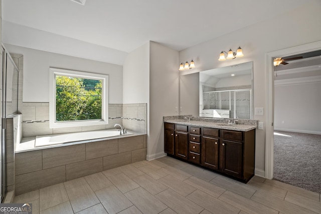 bathroom featuring vanity, ceiling fan, and shower with separate bathtub