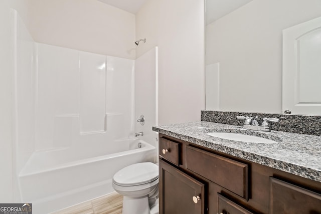 full bathroom with tile patterned flooring, shower / washtub combination, vanity, and toilet