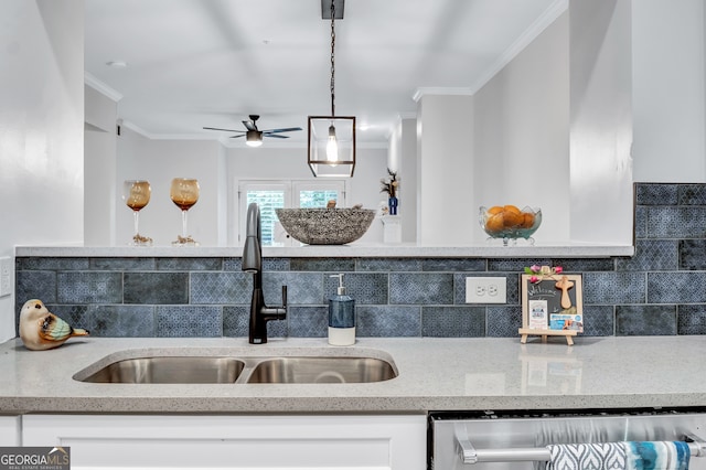 kitchen with dishwasher, sink, backsplash, pendant lighting, and white cabinetry