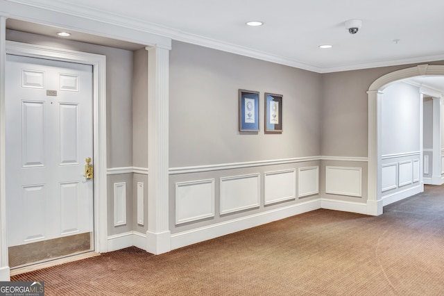 hall featuring carpet flooring and ornamental molding