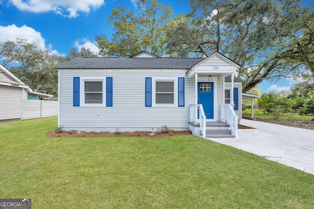 bungalow with a front lawn