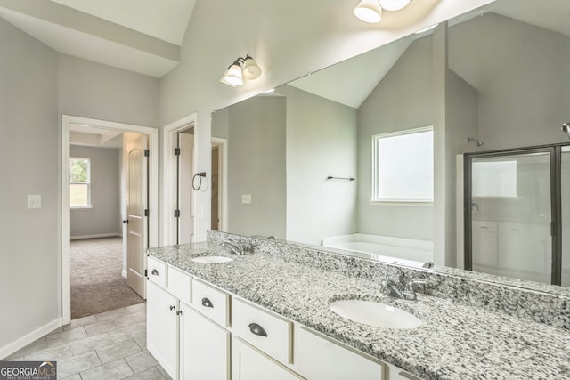 bathroom featuring tile patterned flooring, vanity, plus walk in shower, and lofted ceiling