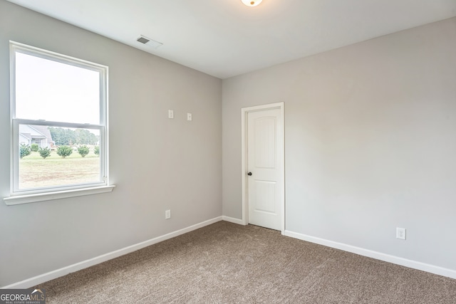 unfurnished room featuring carpet flooring