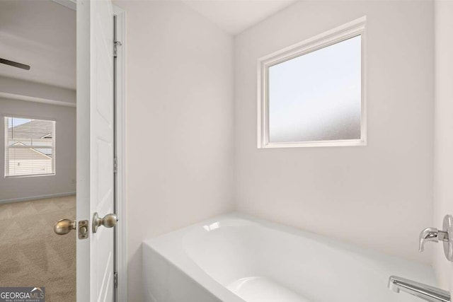 bathroom featuring a tub to relax in