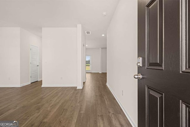 foyer with dark hardwood / wood-style flooring