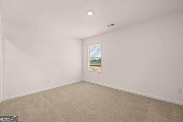 unfurnished room with carpet flooring