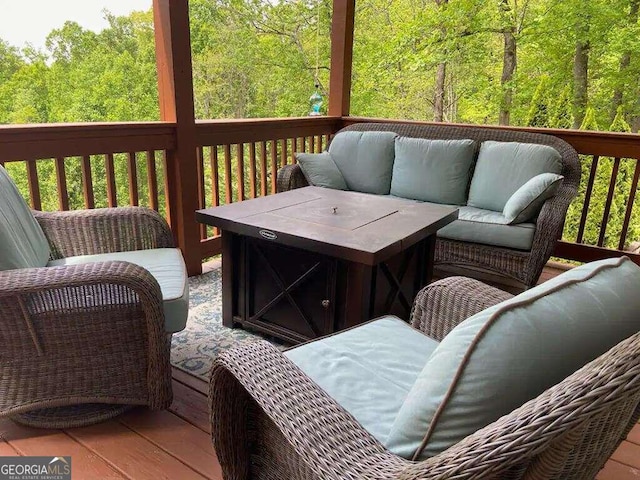 wooden terrace with outdoor lounge area