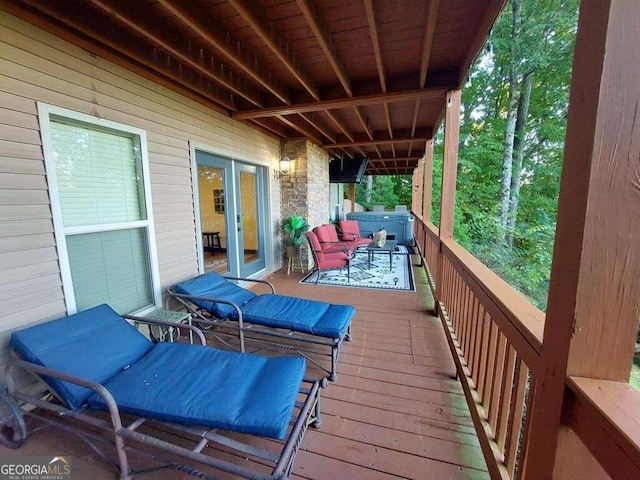 wooden deck featuring an outdoor living space