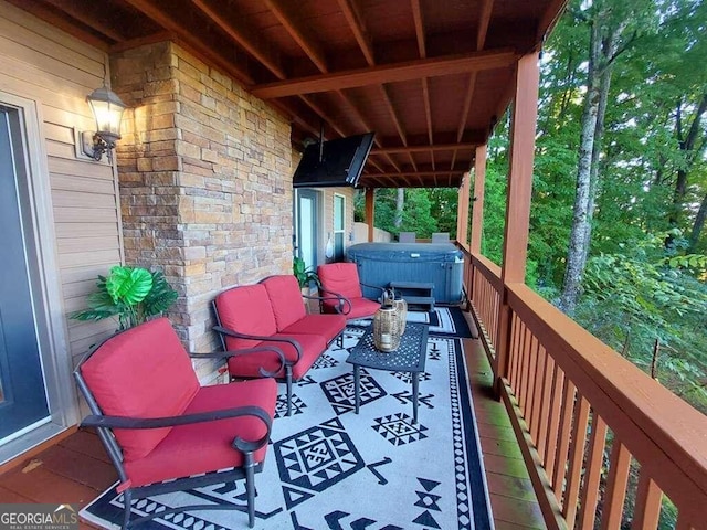 wooden deck featuring a hot tub