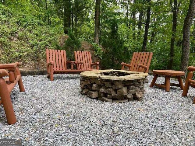 view of patio / terrace with a fire pit