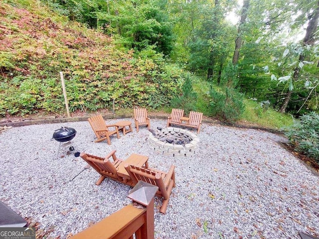 view of patio / terrace featuring an outdoor fire pit