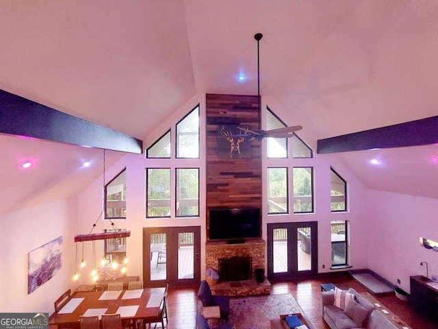 living room featuring a fireplace, a wealth of natural light, ceiling fan, and high vaulted ceiling