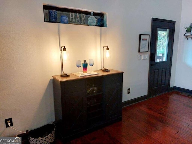 entrance foyer featuring dark hardwood / wood-style floors