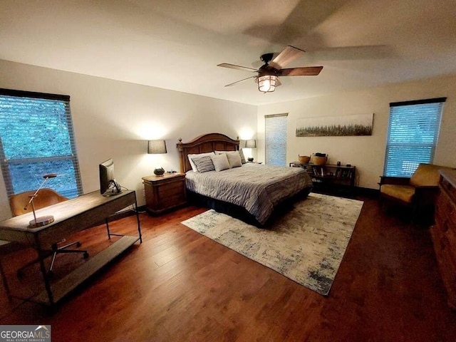 bedroom featuring dark hardwood / wood-style flooring and ceiling fan