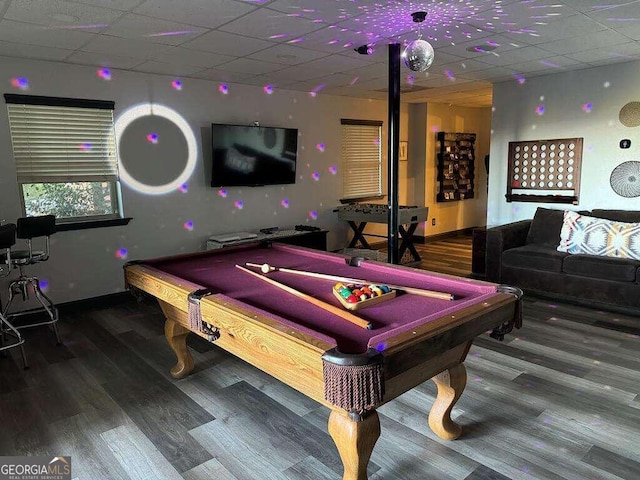 playroom with wood-type flooring and a drop ceiling